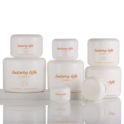 O frasco de empacotamento de creme branco redondo, corpo desnata os frascos 50g cosméticos