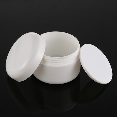 O frasco de empacotamento de creme branco redondo, corpo desnata os frascos 50g cosméticos